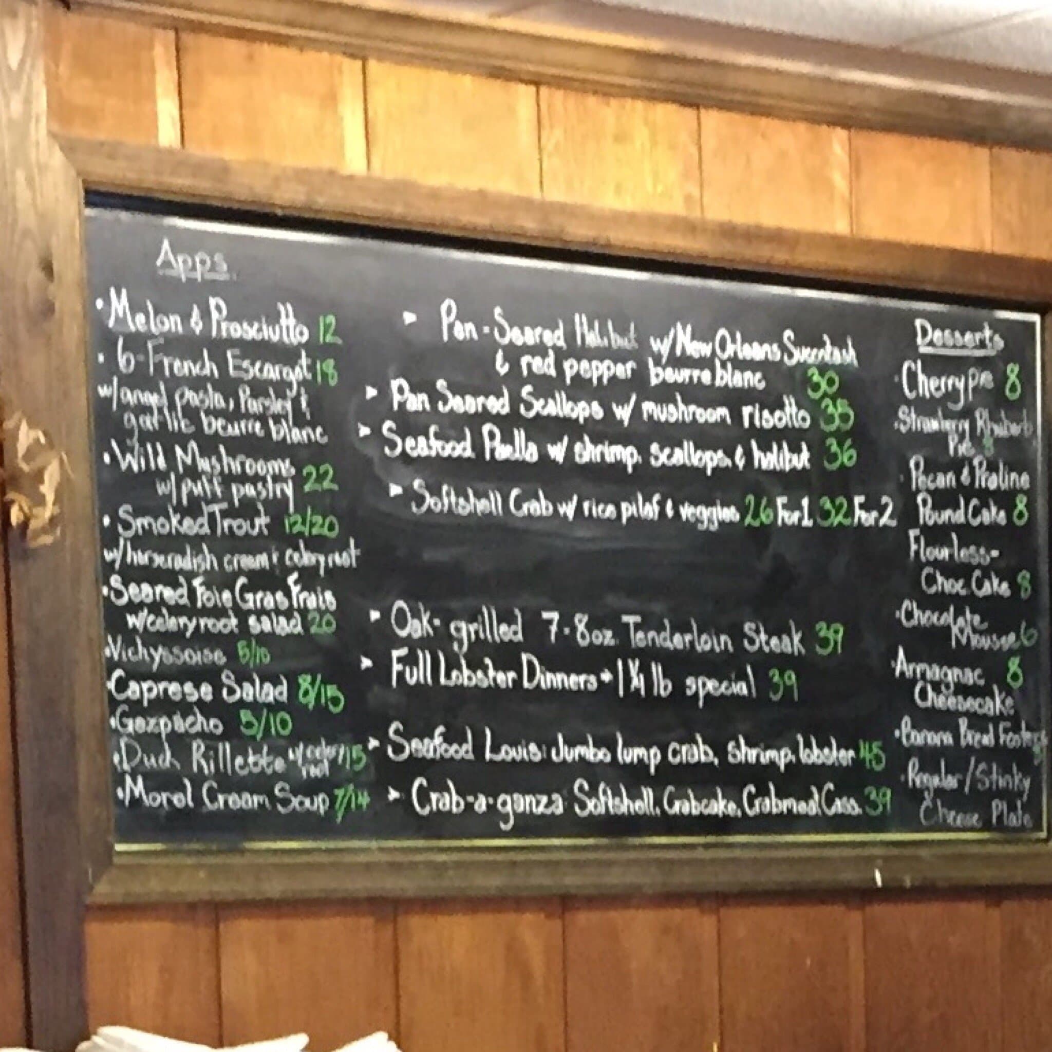 The Tastings specials blackboard, chalked edge to edge: appetizers, entrees and desserts with prices