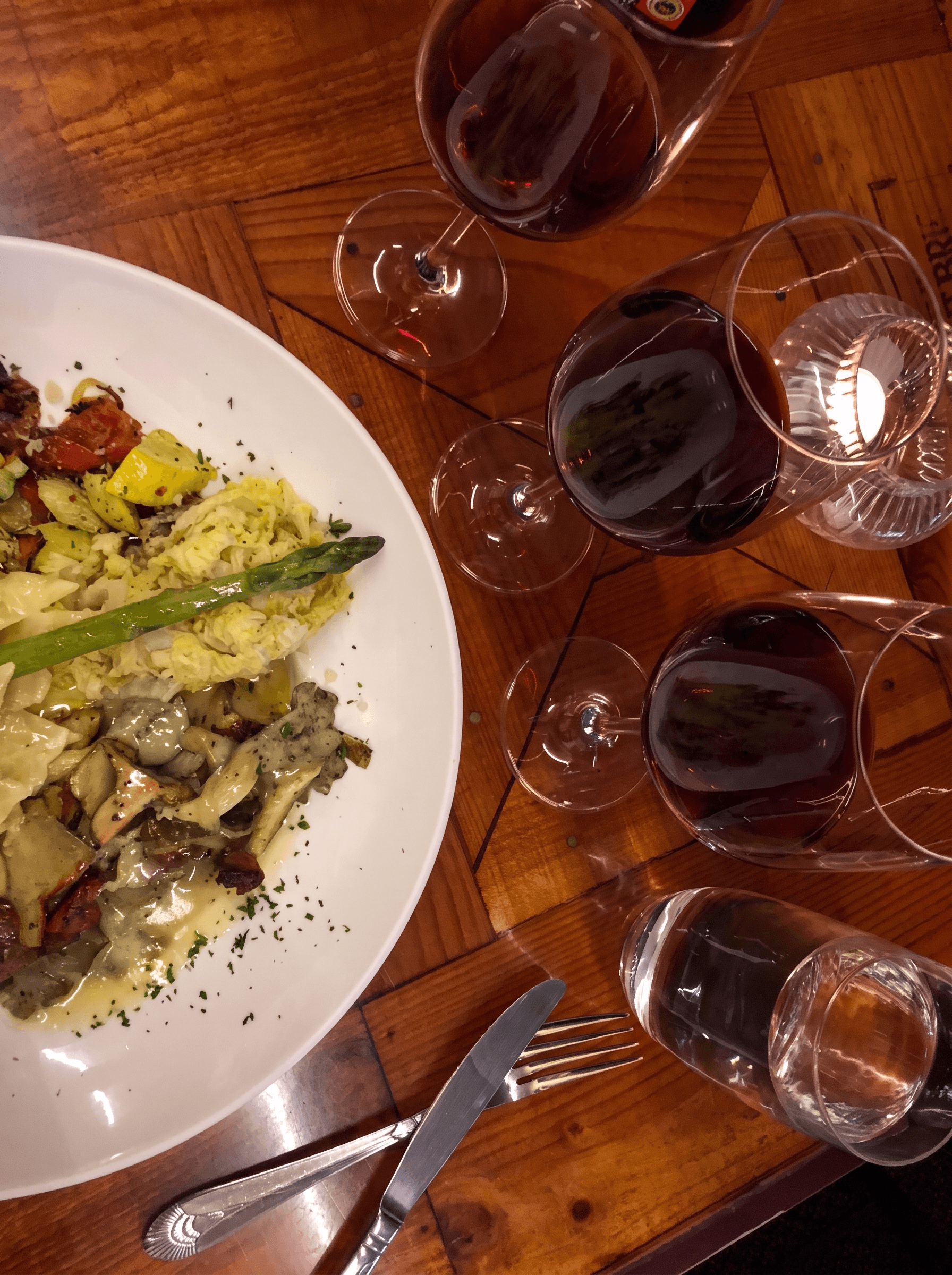 Dinner with a wine flight on a crate-lid table